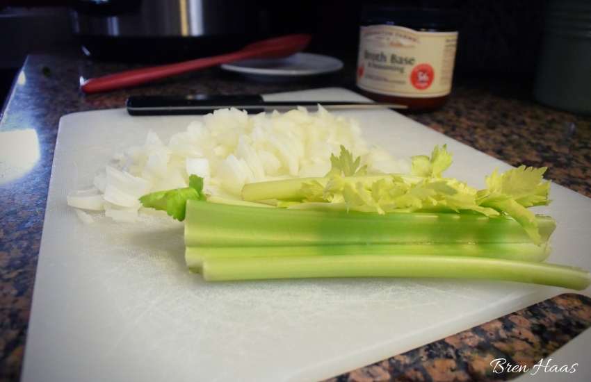 celery and onion on cutting board