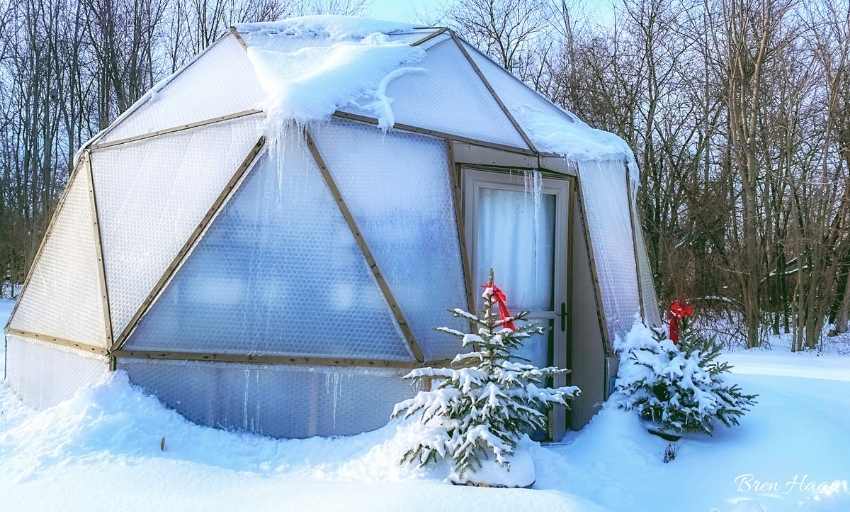 dome greenhouse with snow on top